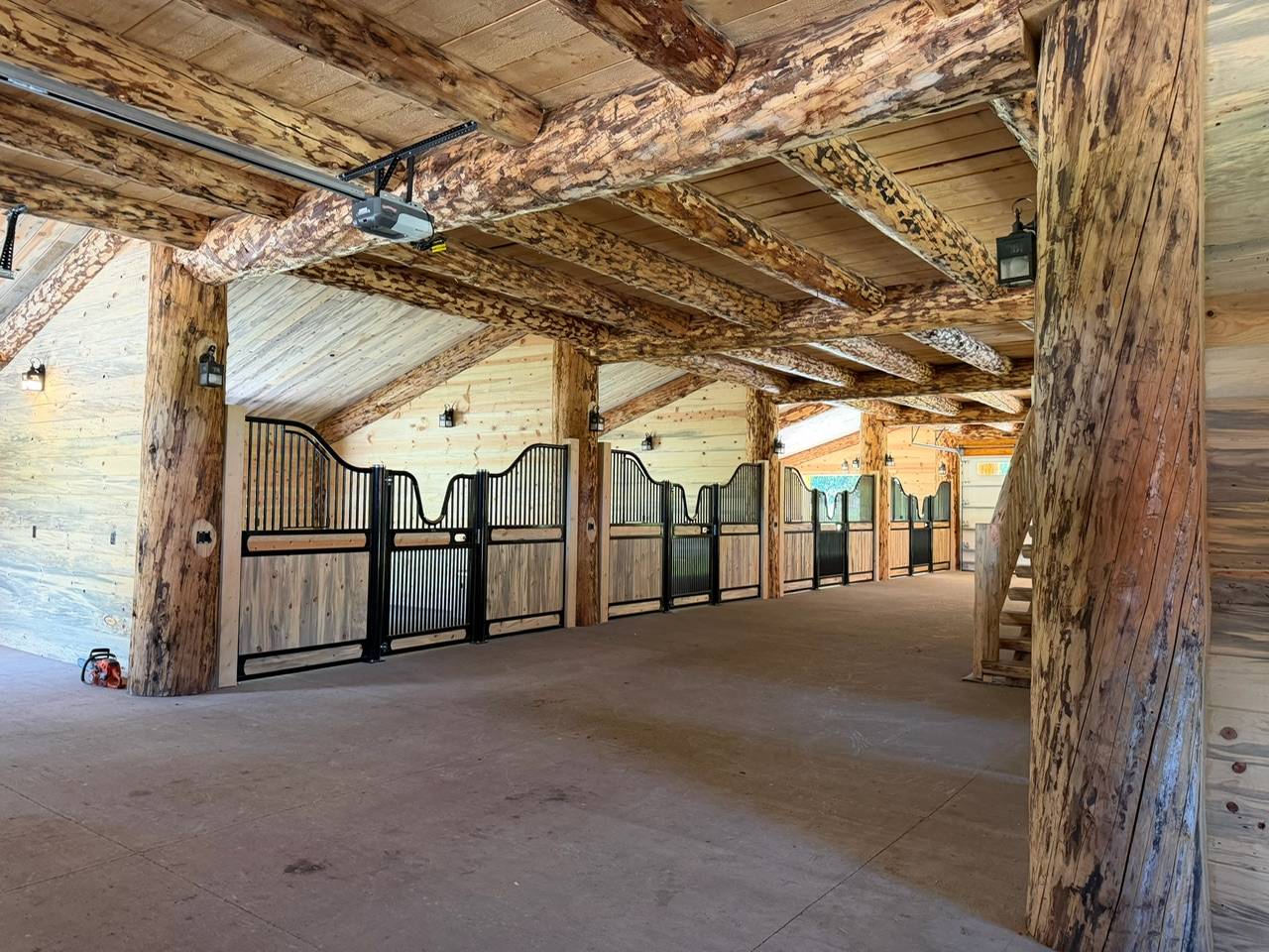 Finished stalls under exposed log beams