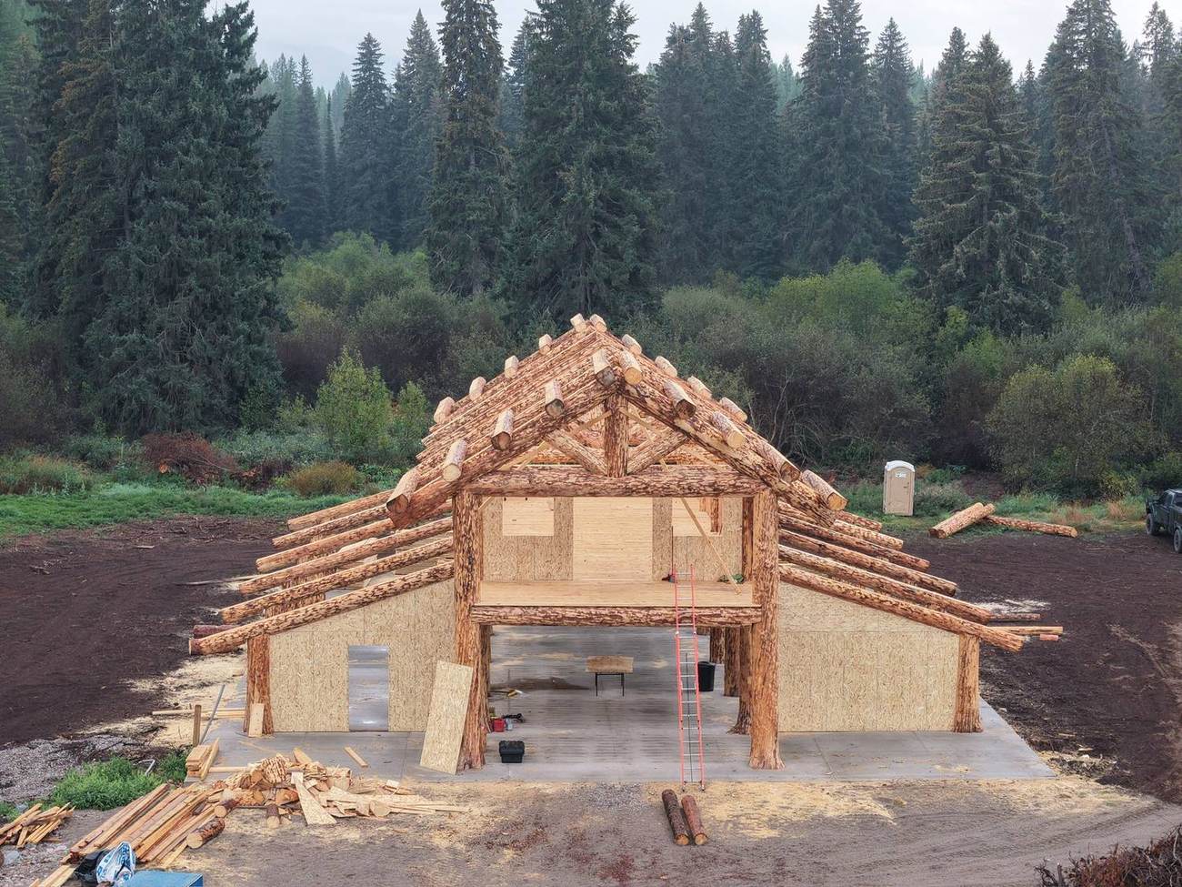 Gable truss raised, mist in the trees behind