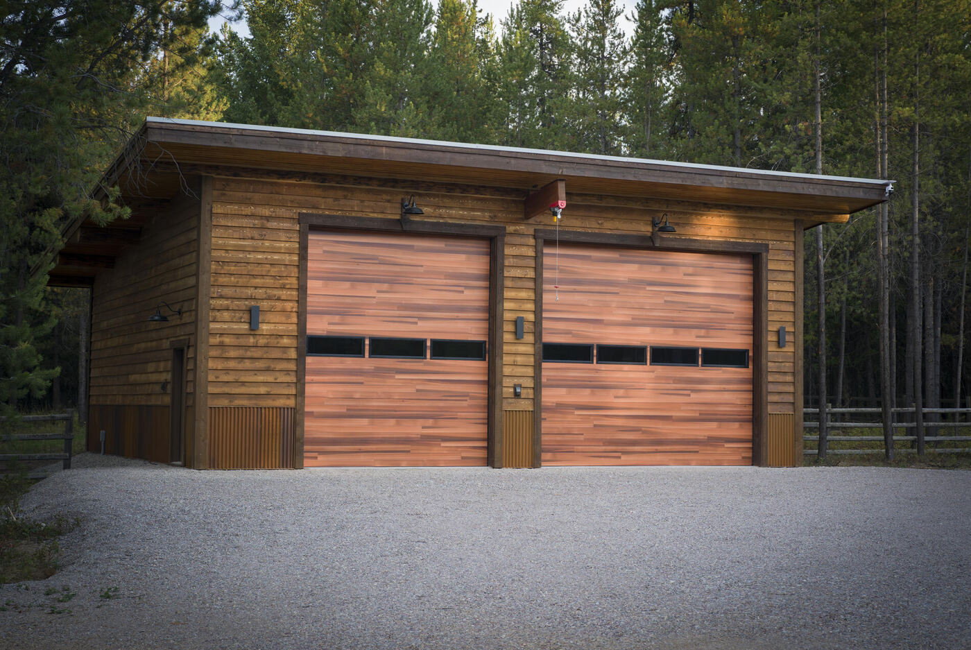 Two-bay timber garage with cedar doors under a single-pitch roof