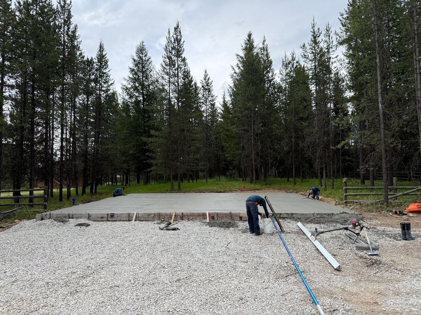 Crew finishing the surface of a freshly poured slab