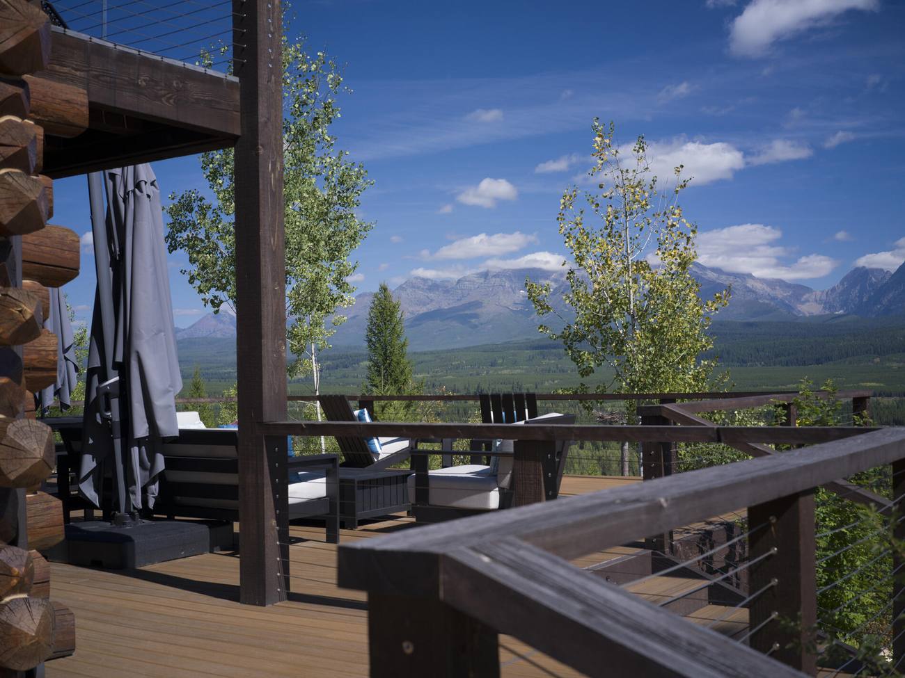 Covered deck with seating looking out to the mountains